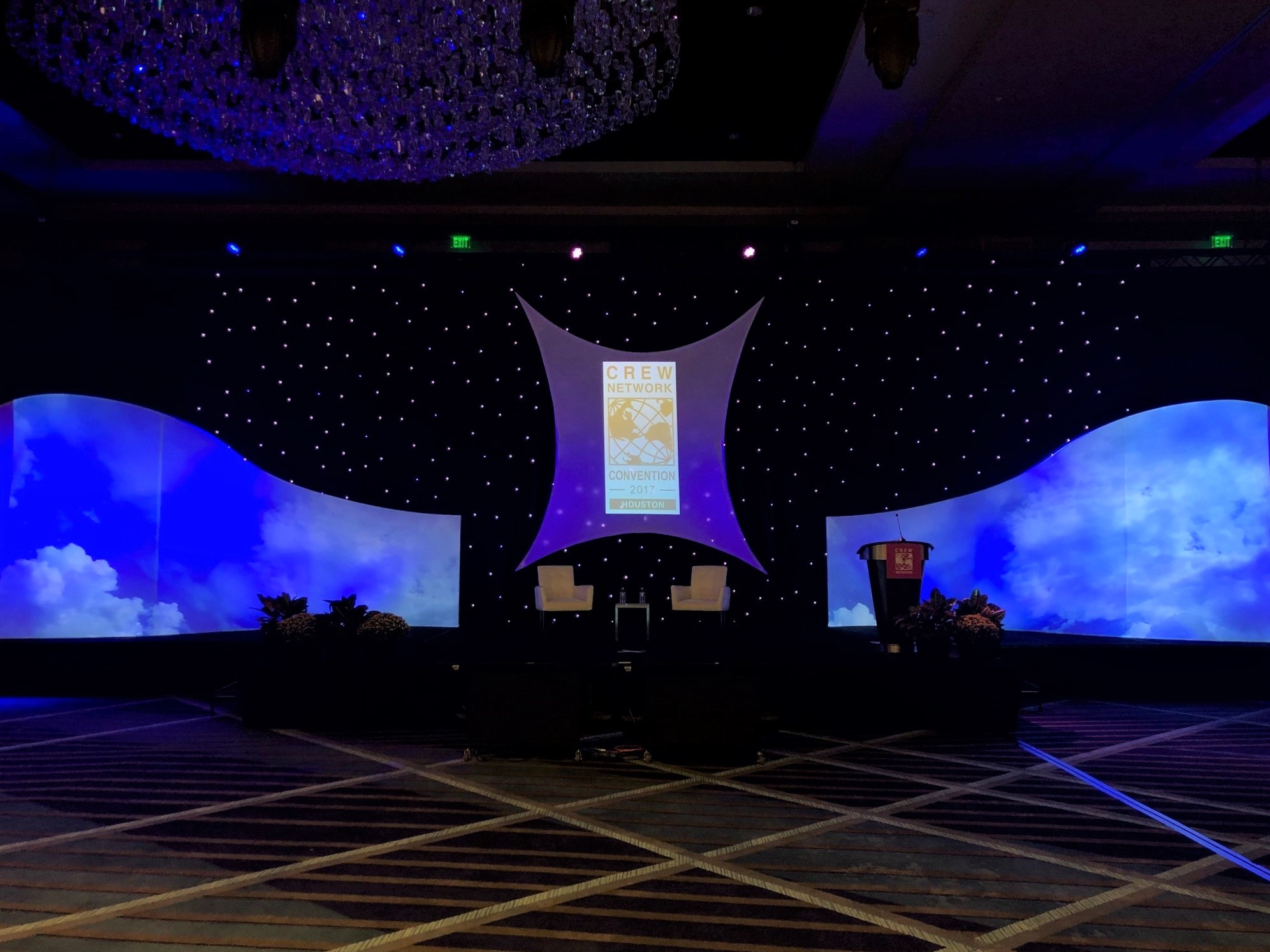 Two Tremolo Panels with 12K Projectors Backdropped with LED Curtain & Spandex